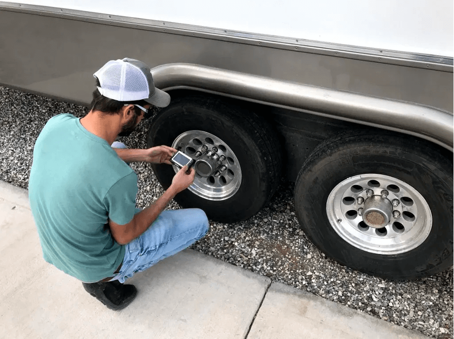 Man doing RV tyre inspection 