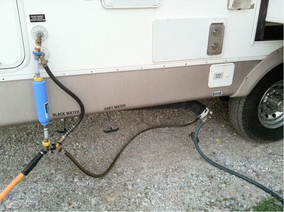 Hose attached to the fresh water spigot of RV.