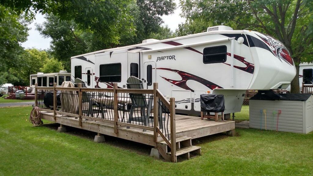 An extended RV deck spans the length of the RV